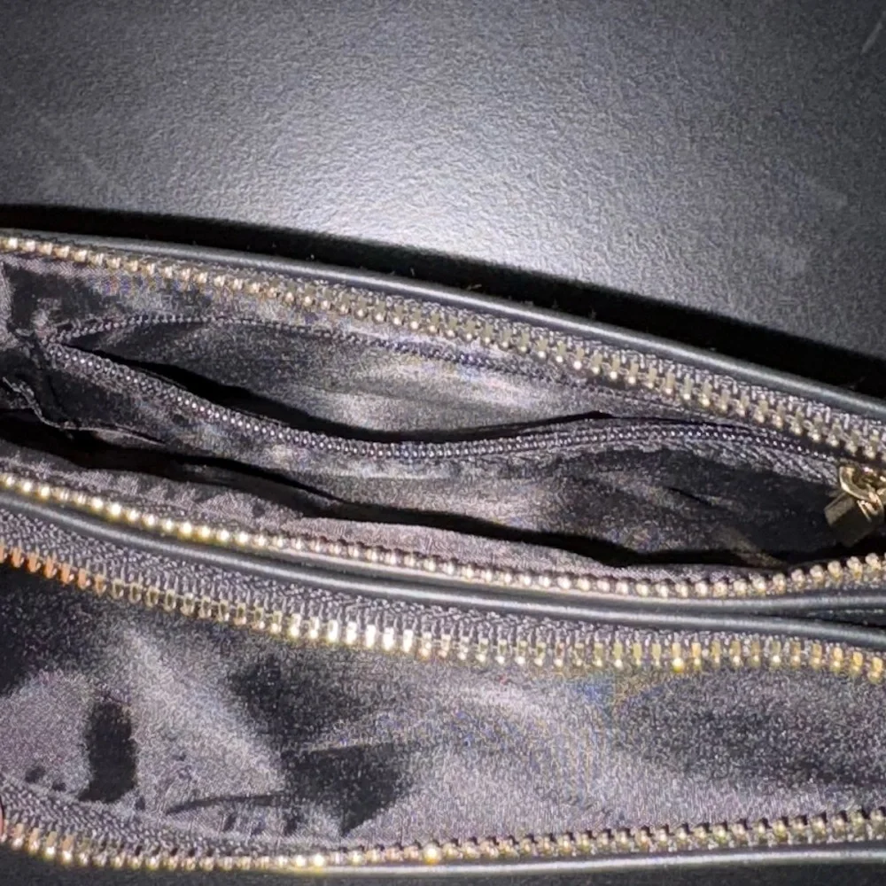 Versace Perfums Black Leather Wristlet with Gold Accents